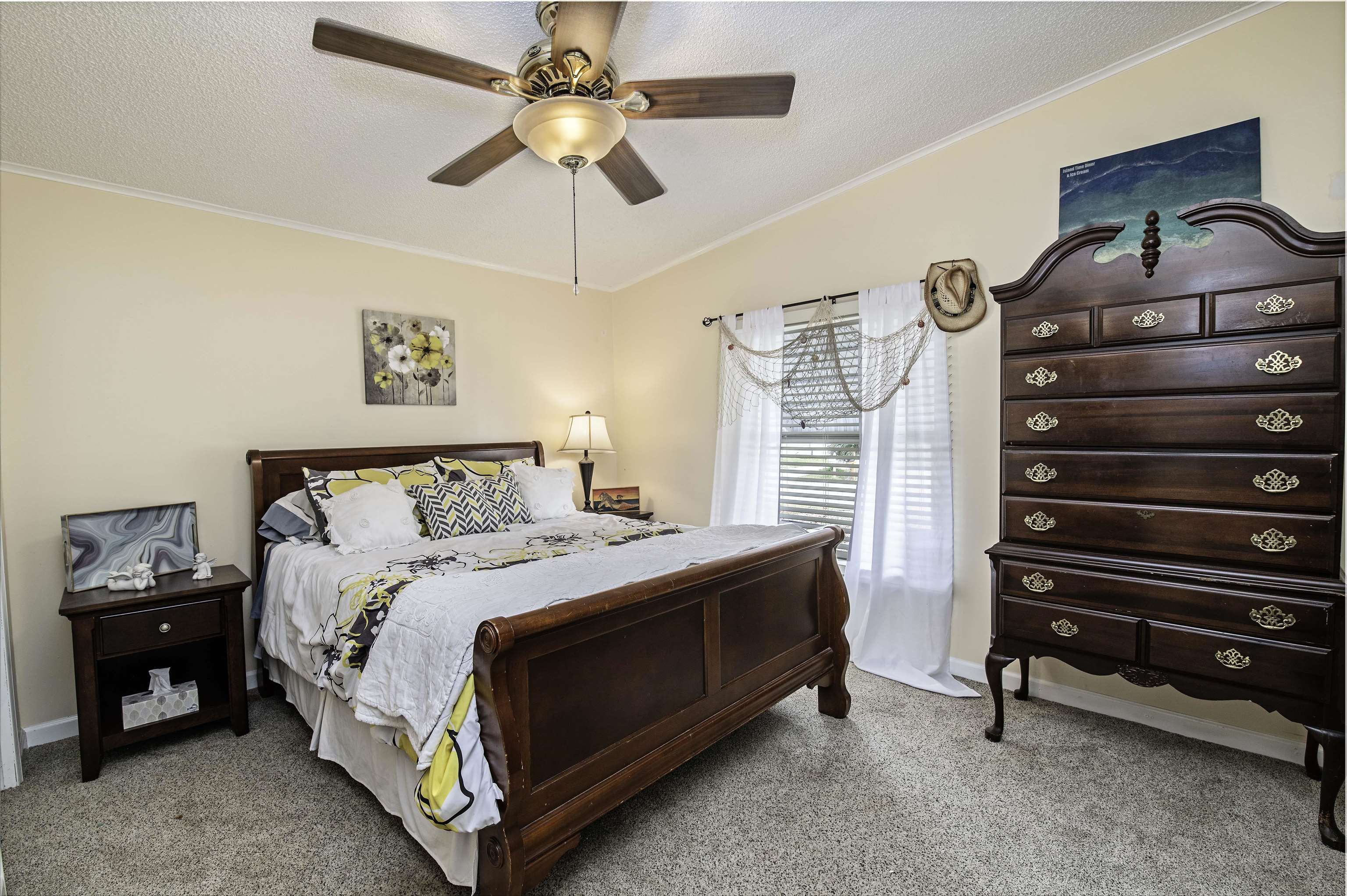 266 Pizarro Road St. Augustine, FL 32080 - Photo 19 of 26 a bedroom with a bed and a chandelier