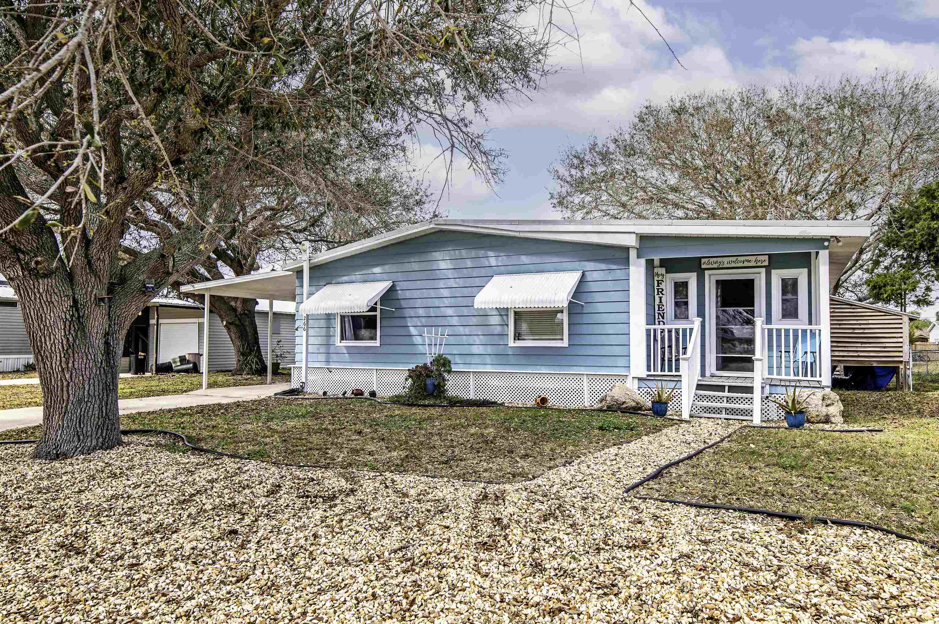 266 Pizarro Road St. Augustine, FL 32080 - Photo 2 of 26 a front view of a house with a yard and garage