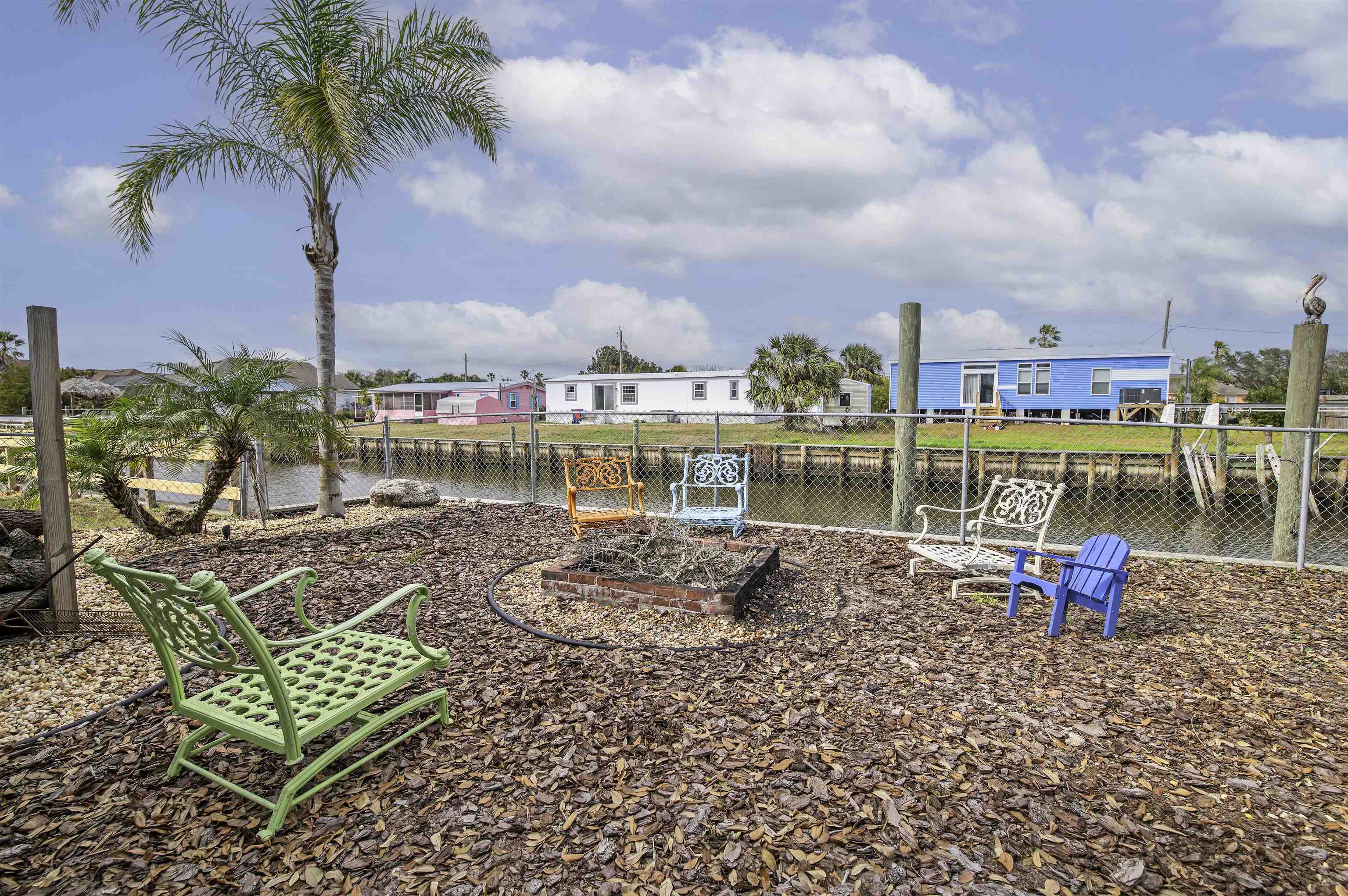 266 Pizarro Road St. Augustine, FL 32080 - Photo 22 of 26 a view of a swimming pool with a lounge chair