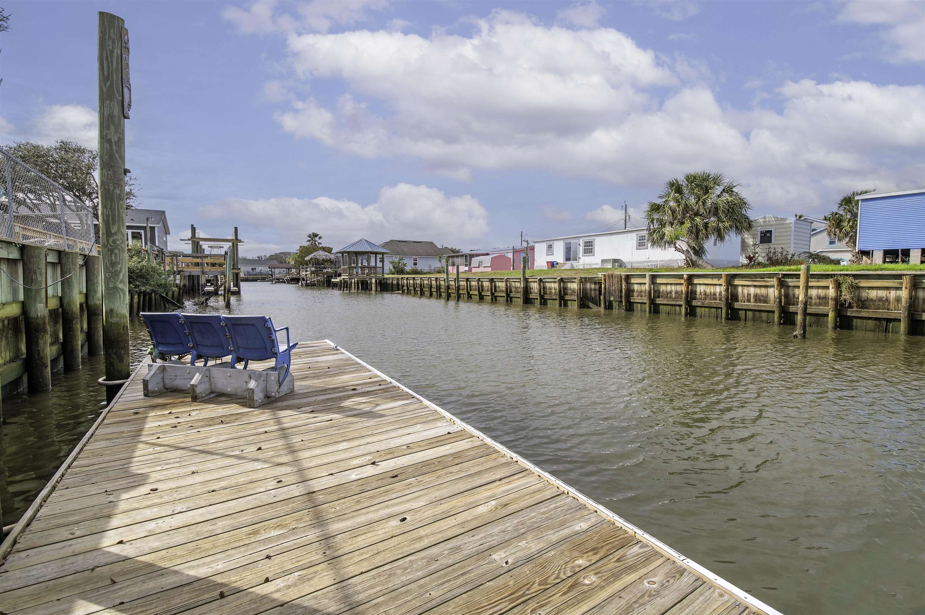 266 Pizarro Road St. Augustine, FL 32080 - Photo 25 of 26 a view of a lake with boats and trees in the background