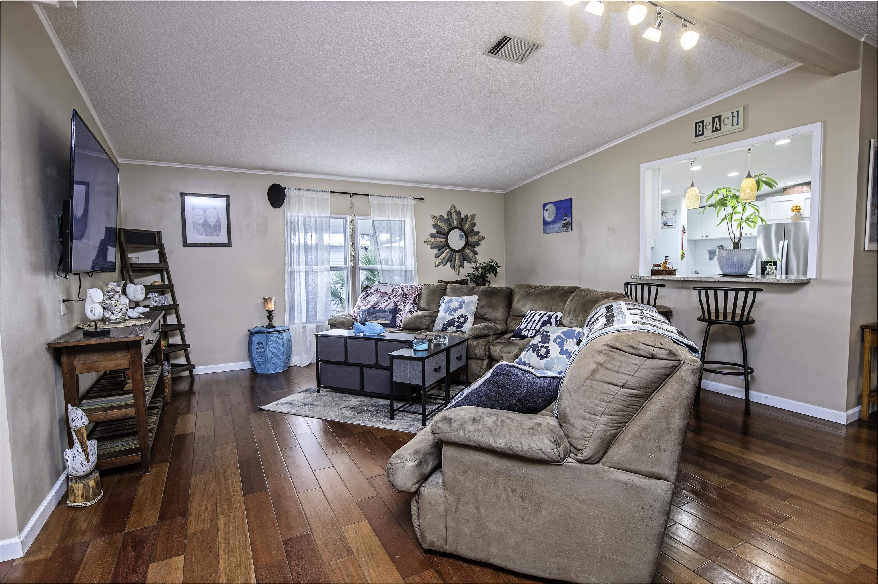 266 Pizarro Road St. Augustine, FL 32080 - Photo 7 of 26 a living room with furniture and a wooden floor