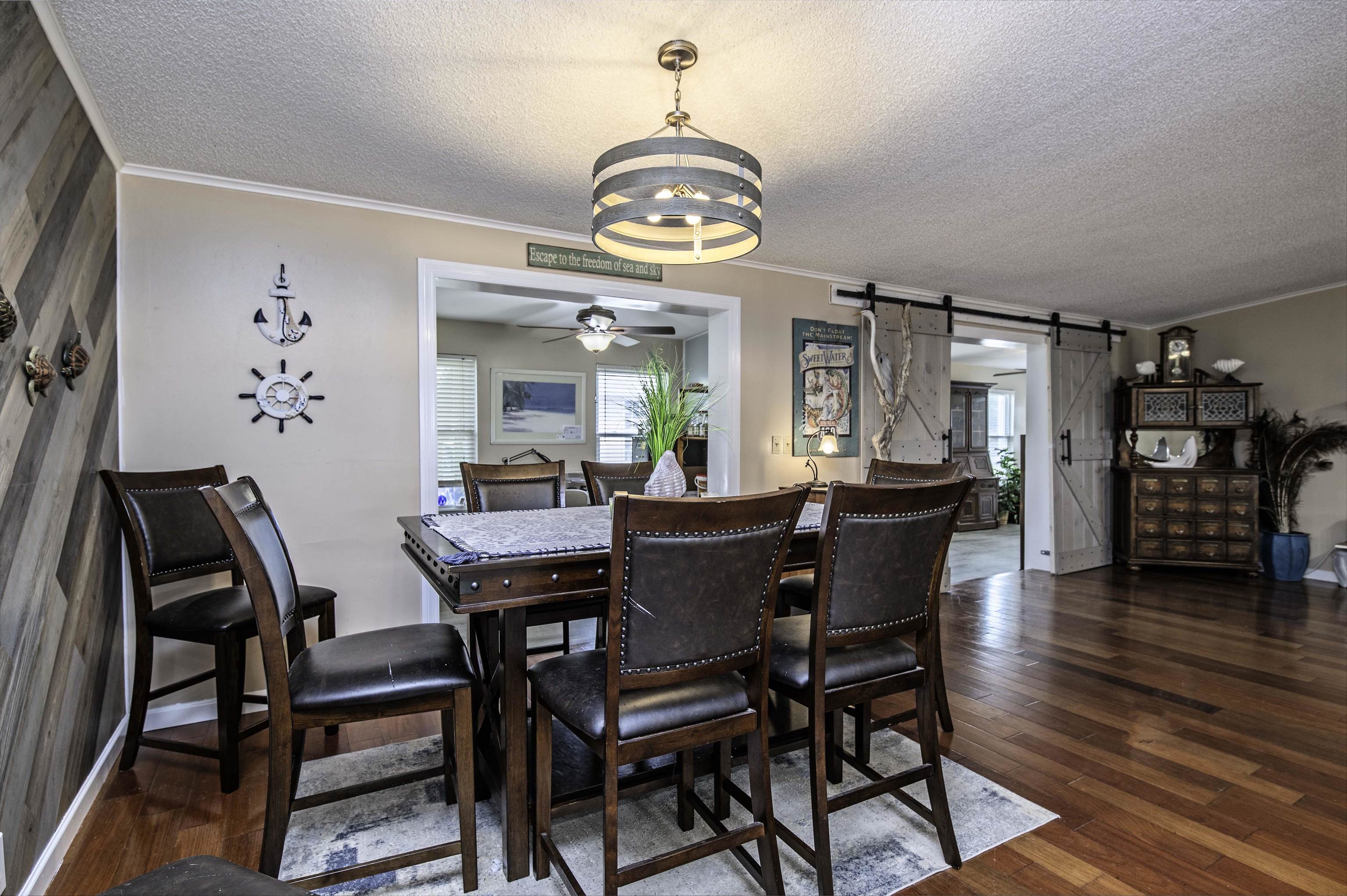 266 Pizarro Road St. Augustine, FL 32080 - Photo 8 of 26 a view of a dining room with furniture and wooden floor