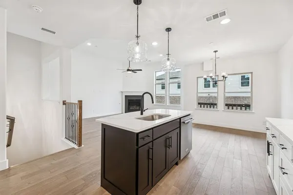 a kitchen that has a lot of cabinets in it