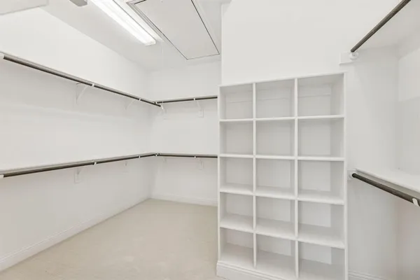 a view of an empty walk in closet
