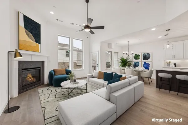 a living room with furniture fireplace and a flat screen tv