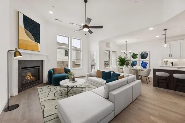 a living room with furniture fireplace and a flat screen tv