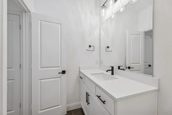 a bathroom with a sink and a mirror