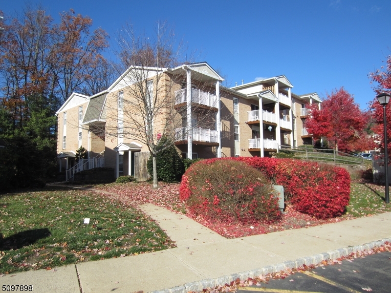164 Vista Drive Cedar Knolls, NJ 07927 - Photo 1 of 19 a view of a white house with a yard in front of it