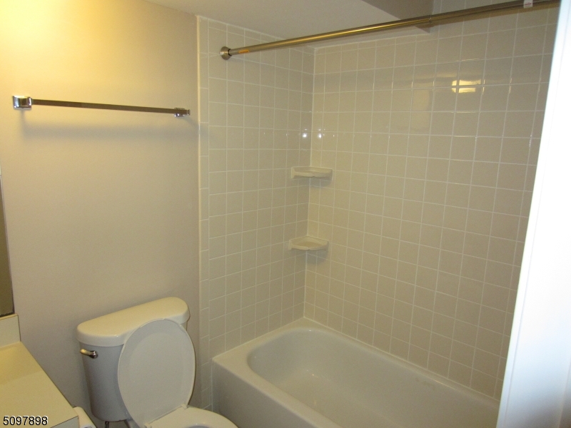 164 Vista Drive Cedar Knolls, NJ 07927 - Photo 15 of 19 a bathroom with a shower and a toilet