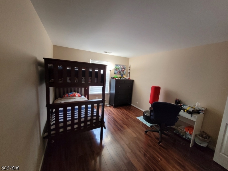 164 Vista Drive Cedar Knolls, NJ 07927 - Photo 16 of 19 a view of a workspace with furniture and wooden floor