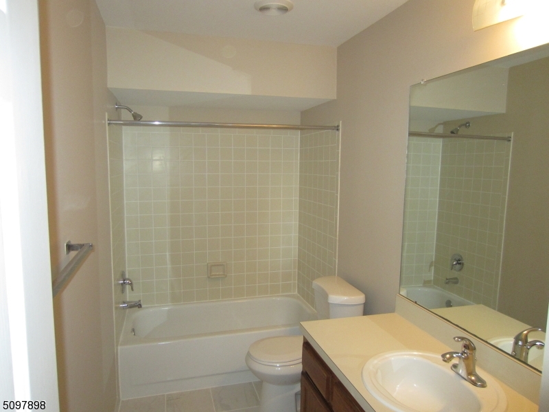 164 Vista Drive Cedar Knolls, NJ 07927 - Photo 18 of 19 a bathroom with a sink a toilet and shower