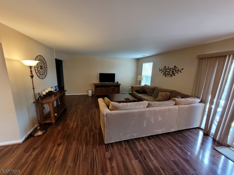 164 Vista Drive Cedar Knolls, NJ 07927 - Photo 8 of 19 a living room with furniture and a flat screen tv