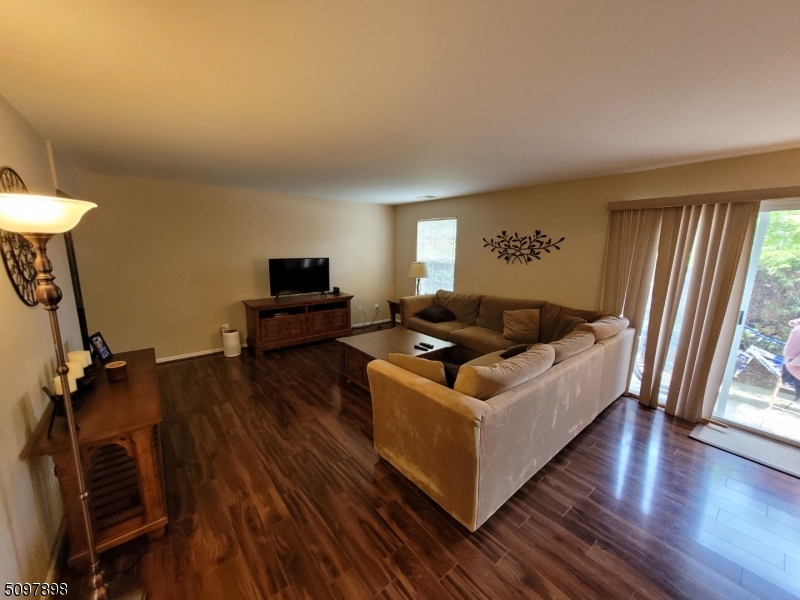 164 Vista Drive Cedar Knolls, NJ 07927 - Photo 9 of 19 a living room with furniture and a flat screen tv