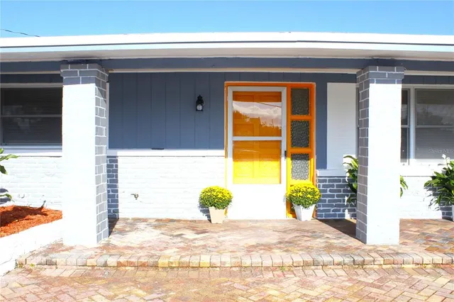 a kitchen with a sink stainless steel appliances and white cabinets