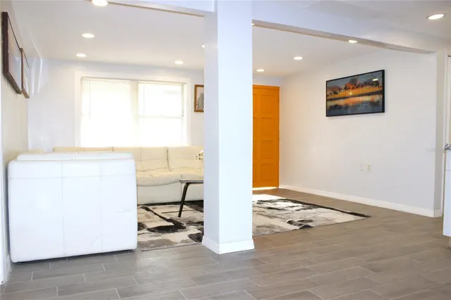 a kitchen with a refrigerator and a stove top oven