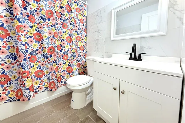 a utility room with dryer washer and a window