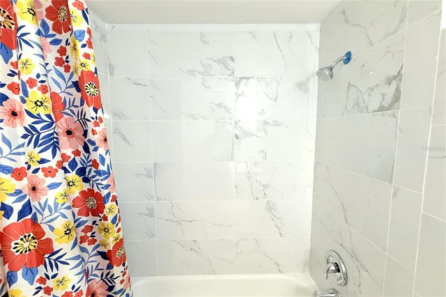 an aerial view of a house with a swimming pool