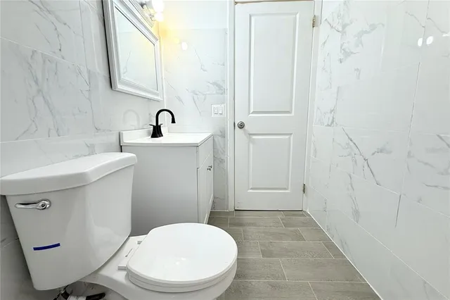 an aerial view of residential houses and outdoor space