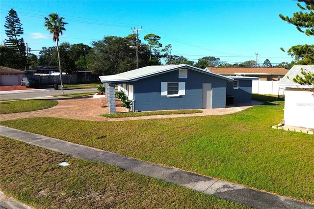 a bed room with a bed and a painting on the wall