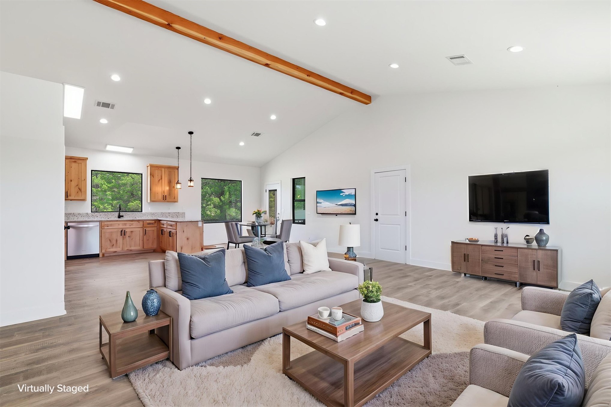 63 Deerfield Road Colbert, OK 74733 - Photo 5 of 33 Expansive living area featuring vaulted ceilings with an exposed wood beam, recessed lighting, and wood-finish flooring