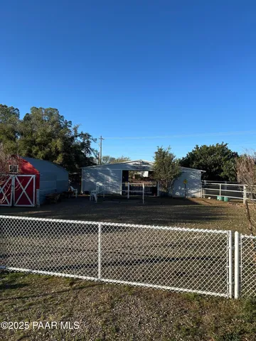 a bedroom with a bed and a television