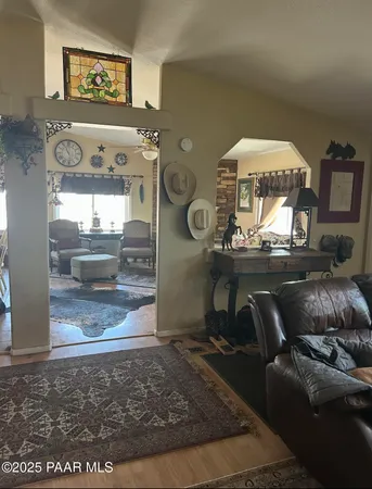 a view of a livingroom view with a fireplace cabinet and a rug