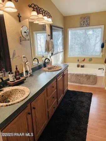 a view of a storage and utility room with a washer dryer