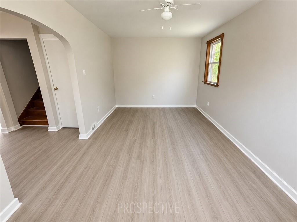3079 Mt Troy Road Pittsburgh, PA 15212 - Photo 5 of 30 wooden floor in an empty room with a window