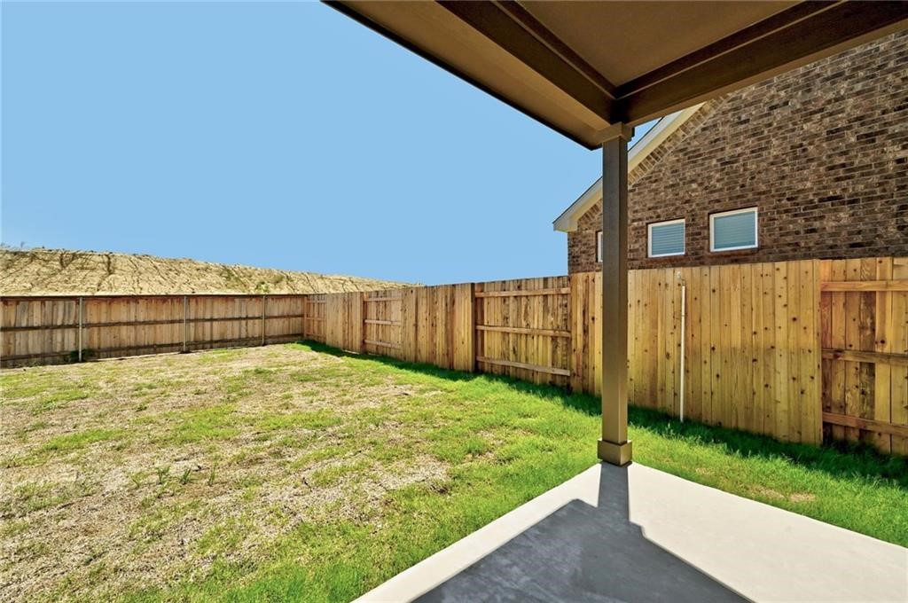 806 Pepperbark Loop Buda, TX 78610 - Photo 22 of 39 a view of a backyard