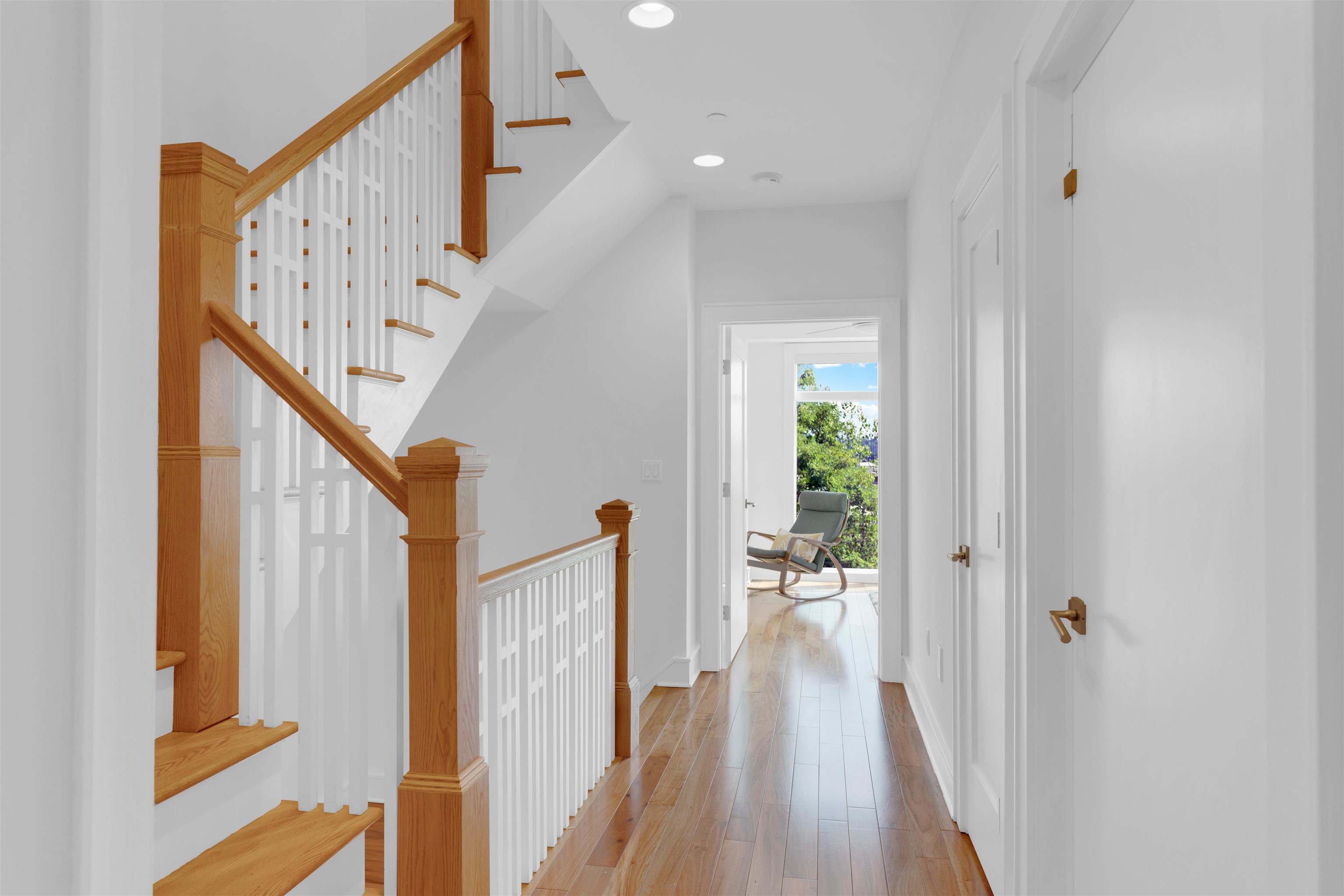 8713-6 Churchill Road, Unit 6 North Bergen, NJ 07047 - Photo 18 of 23 a view of a hallway with wooden floor and staircase