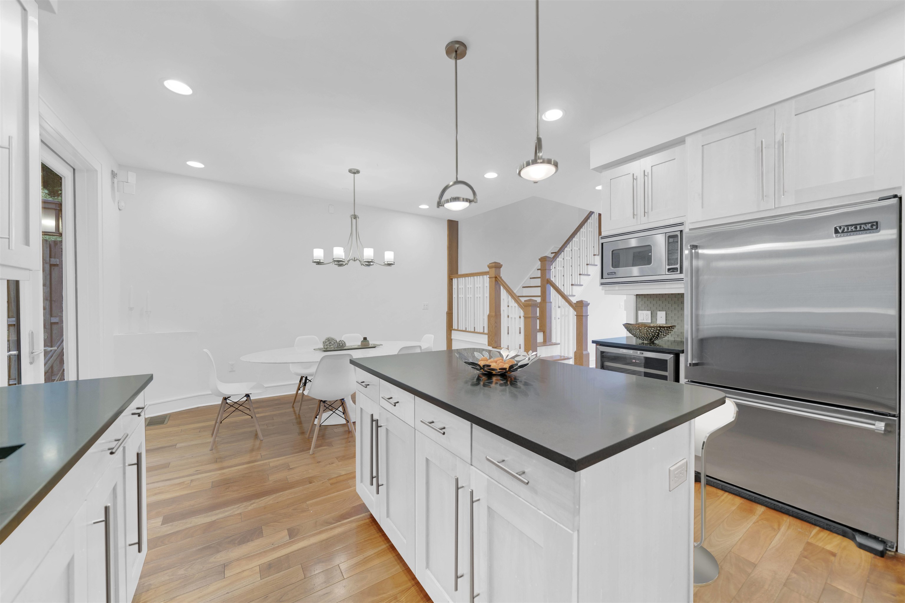 8713-6 Churchill Road, Unit 6 North Bergen, NJ 07047 - Photo 3 of 23 a kitchen with stainless steel appliances granite countertop a sink a stove and a refrigerator