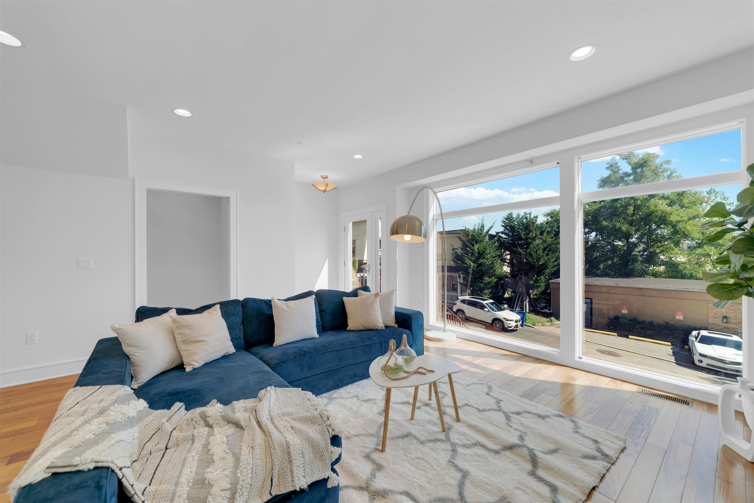 8713-6 Churchill Road, Unit 6 North Bergen, NJ 07047 - Photo 5 of 23 a living room with furniture and a large window