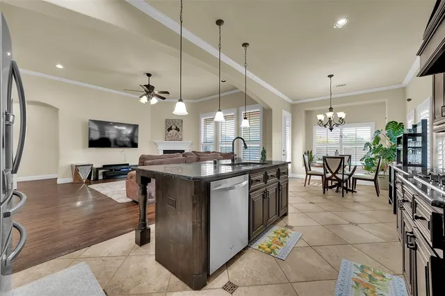 a kitchen with lots of counter top space and dining table