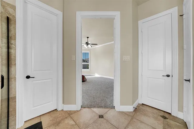 a spacious bathroom with a granite countertop sink mirror and a bathtub