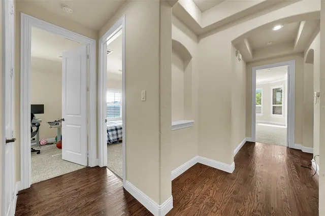 a spacious bedroom with a bed and window
