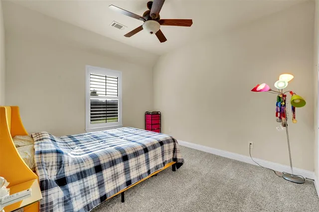 a view of hallway with bathroom and wooden floor