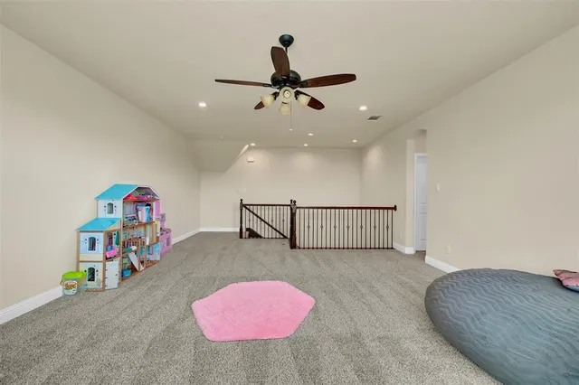 a bedroom with furniture and a flat screen tv