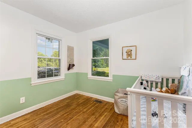 a view of a livingroom with furniture and a window