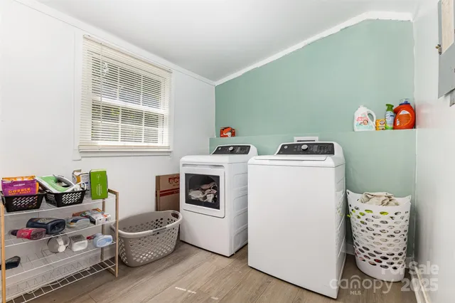 a utility room with toys and wooden floor