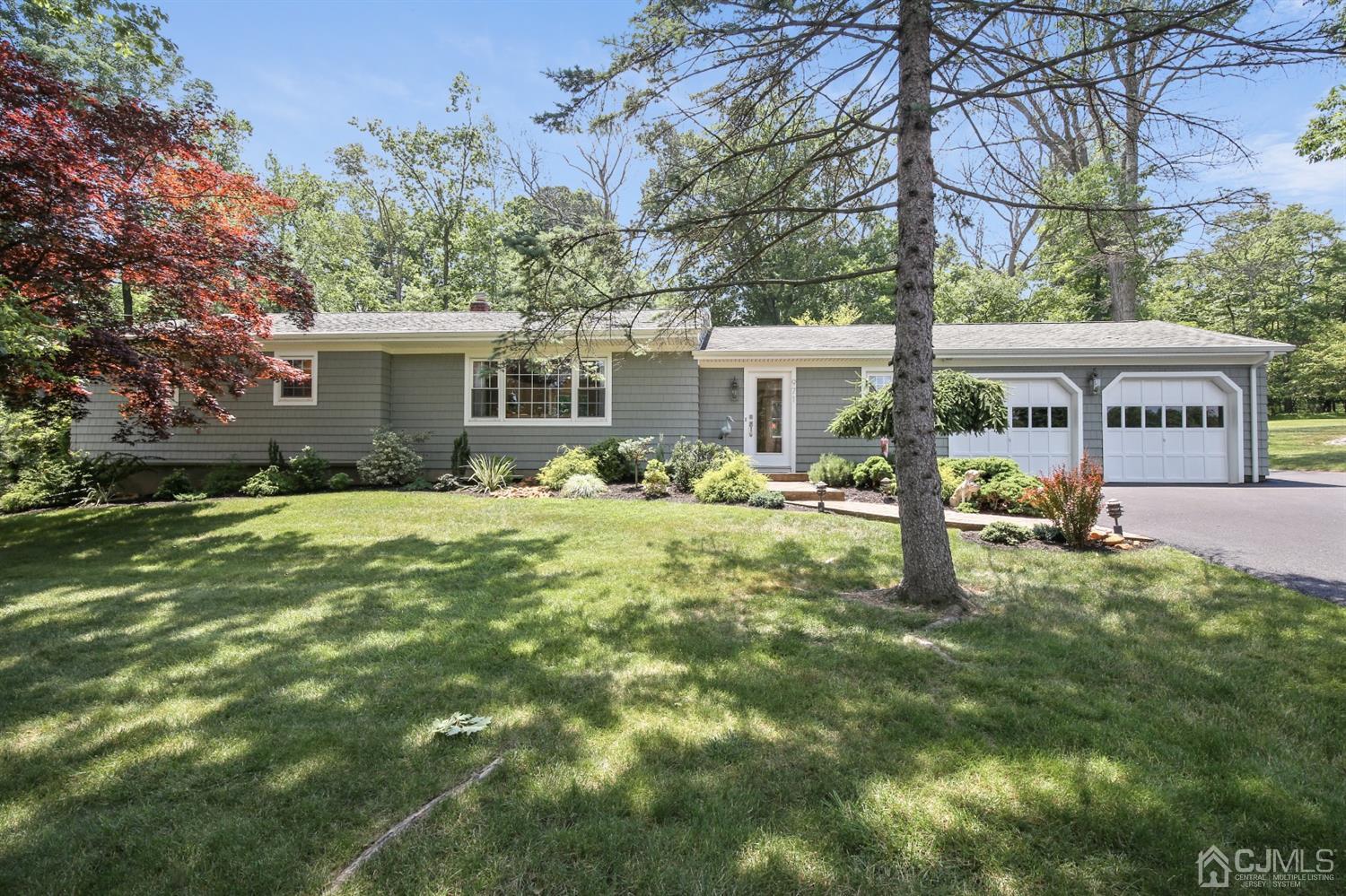 a front view of house with yard and green space