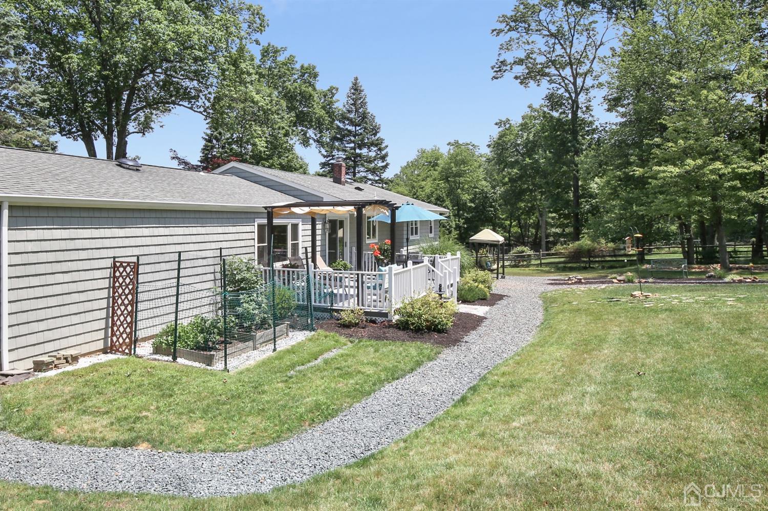 971 Carteret Road Bridgewater, NJ 08807 - Photo 23 of 27 a front view of a house with a yard