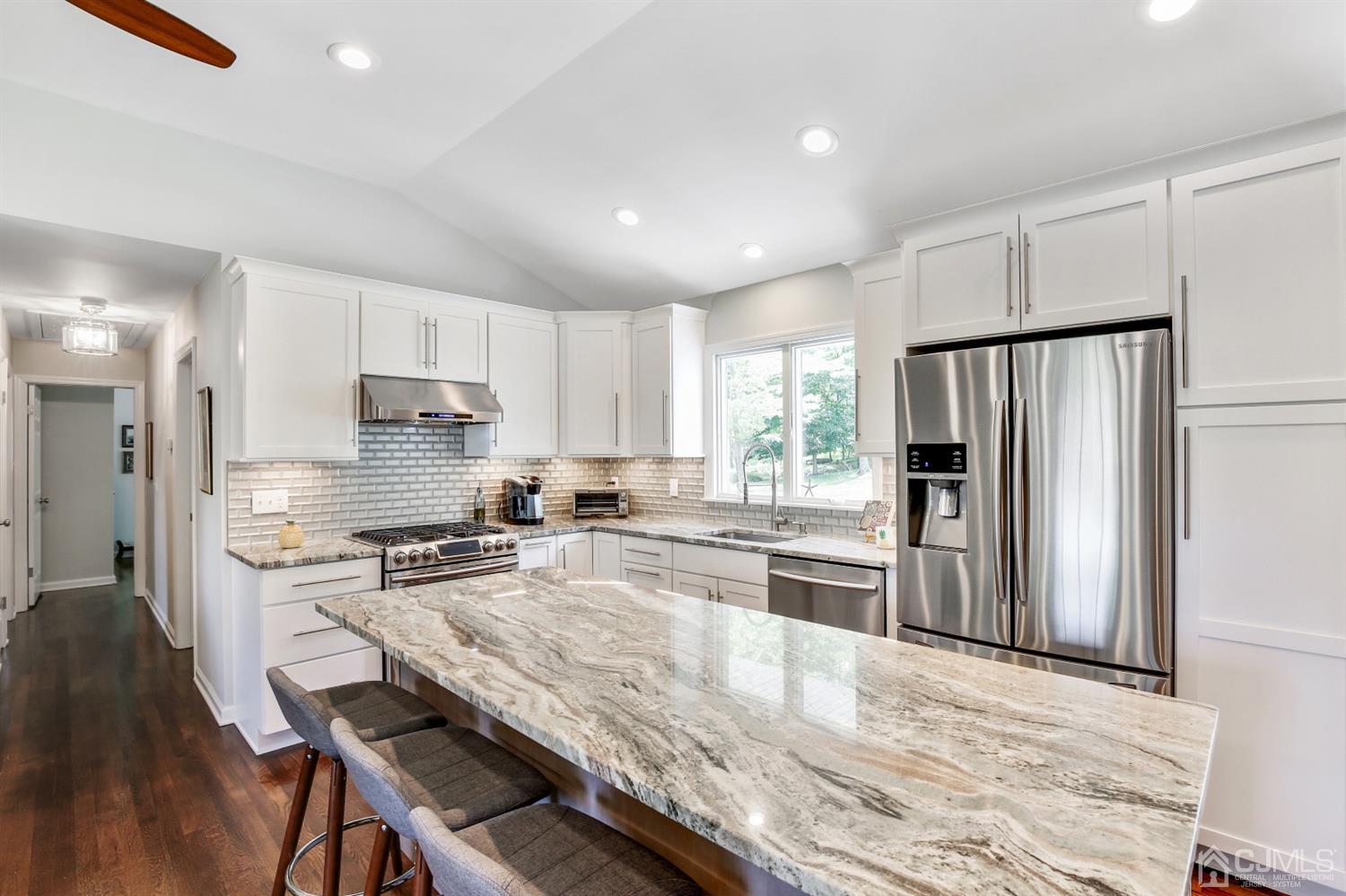 971 Carteret Road Bridgewater, NJ 08807 - Photo 5 of 27 a kitchen with granite countertop a refrigerator stove microwave and cabinets
