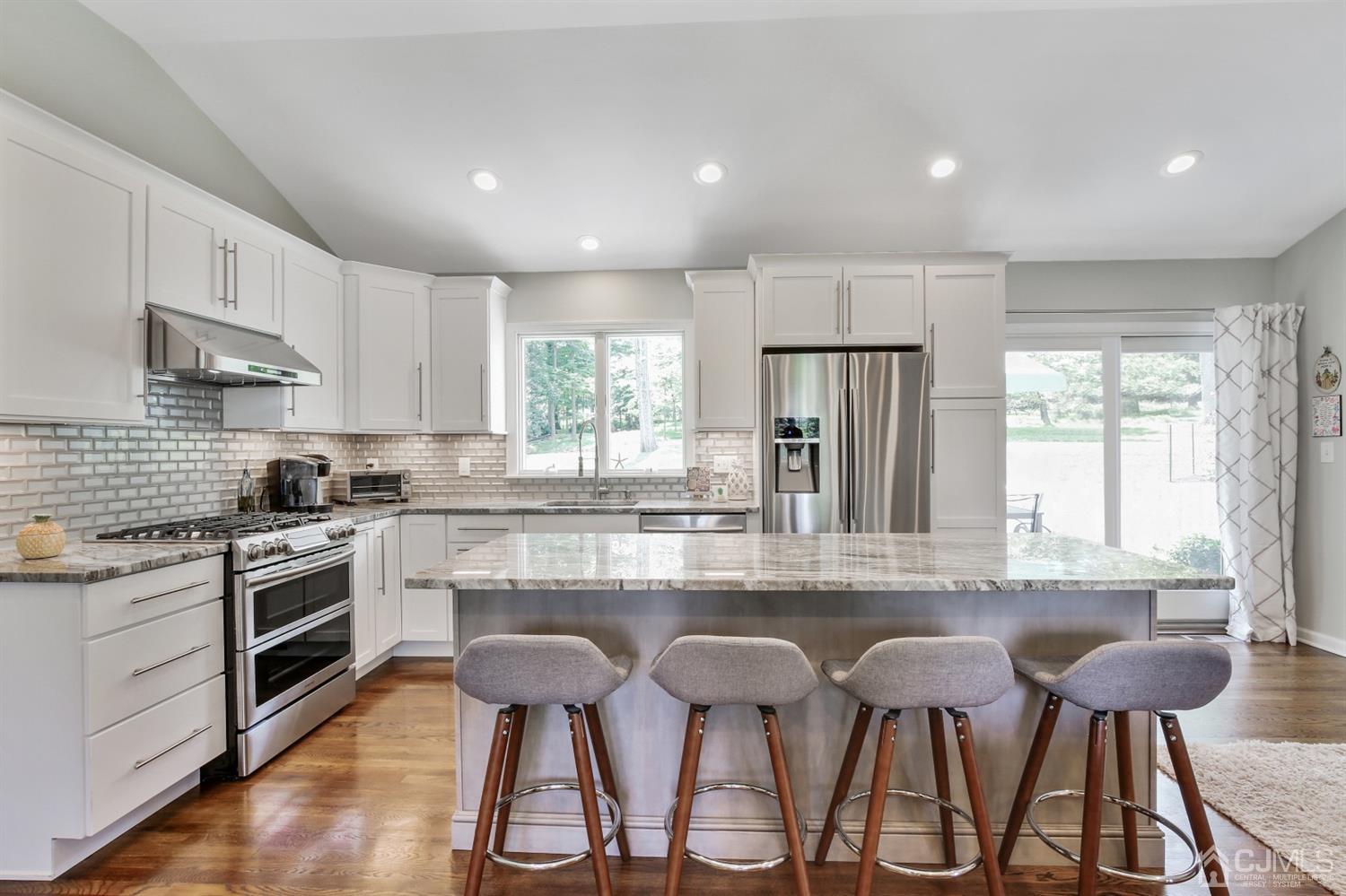 971 Carteret Road Bridgewater, NJ 08807 - Photo 6 of 27 a kitchen with cabinets and chairs