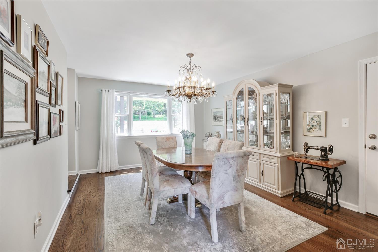 971 Carteret Road Bridgewater, NJ 08807 - Photo 7 of 27 a view of a dining room with furniture and chandelier