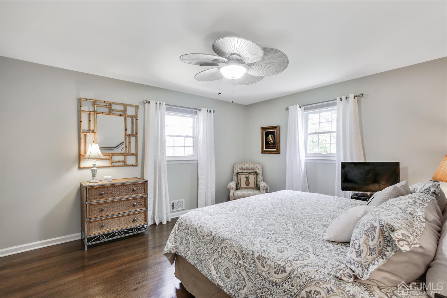 971 Carteret Road Bridgewater, NJ 08807 - Photo 9 of 27 a bedroom with a bed and wooden floor
