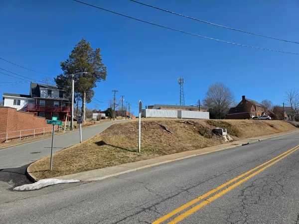 a swimming pool with outdoor seating and yard