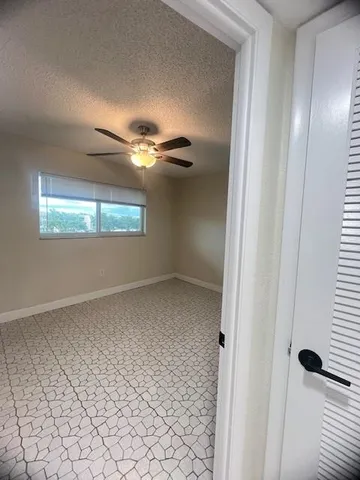 wooden floor in an empty room and a window