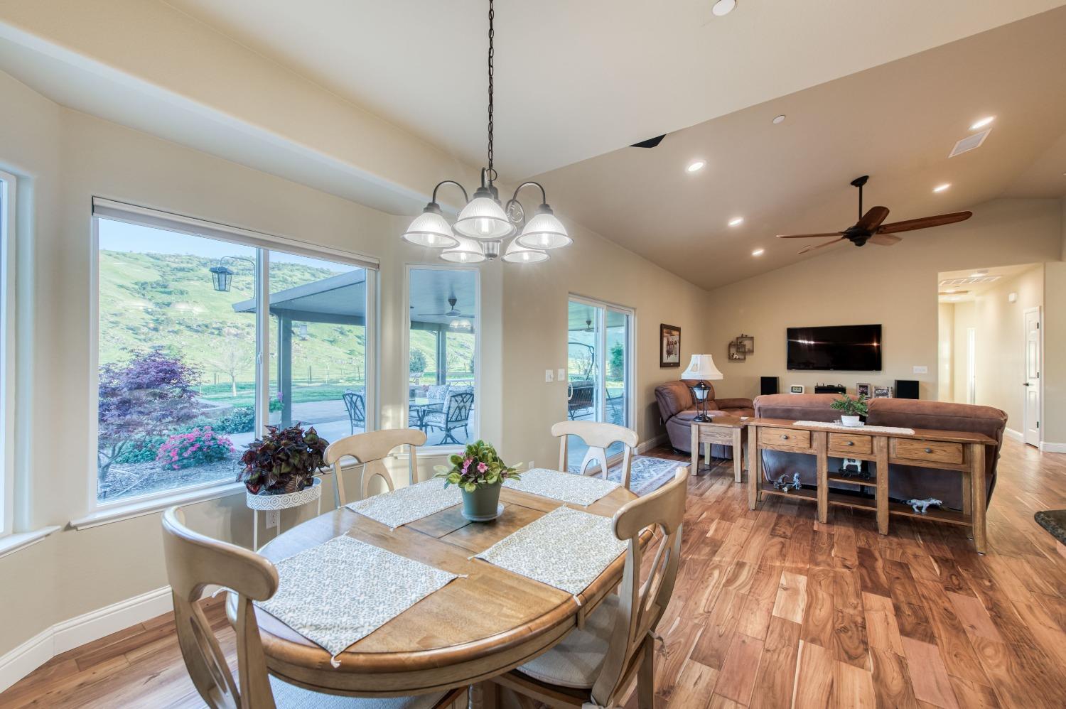 20431 Thermal Road Sanger, CA 93657 - Photo 14 of 88 a view of a dining room with furniture window and wooden floor