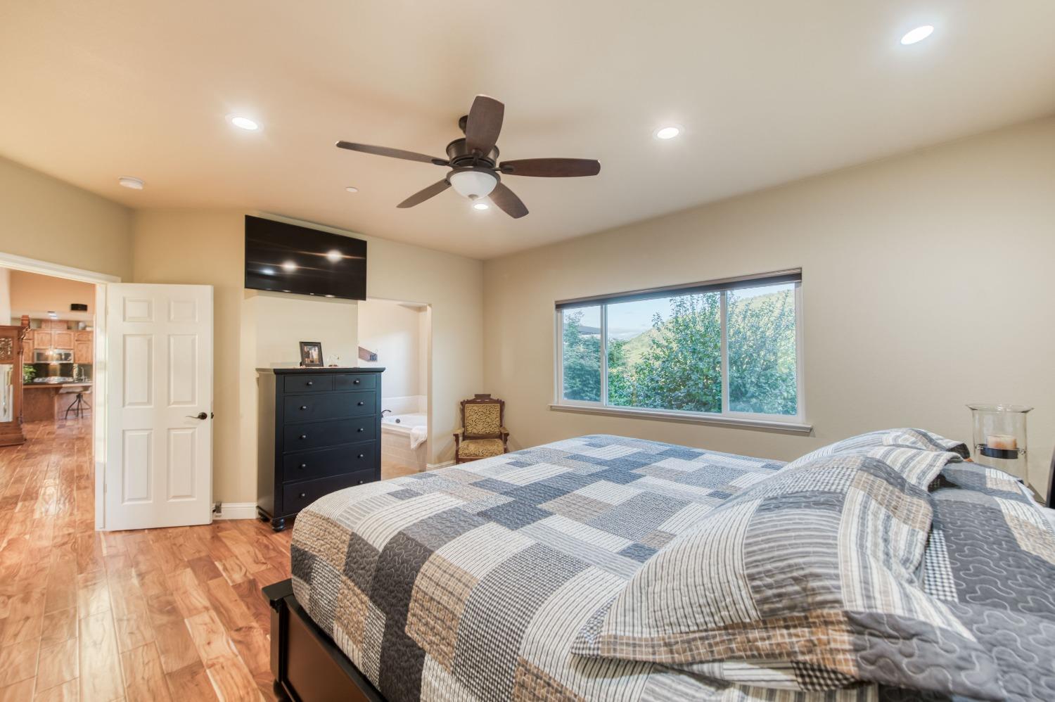 20431 Thermal Road Sanger, CA 93657 - Photo 21 of 88 a bedroom with a bed and a television