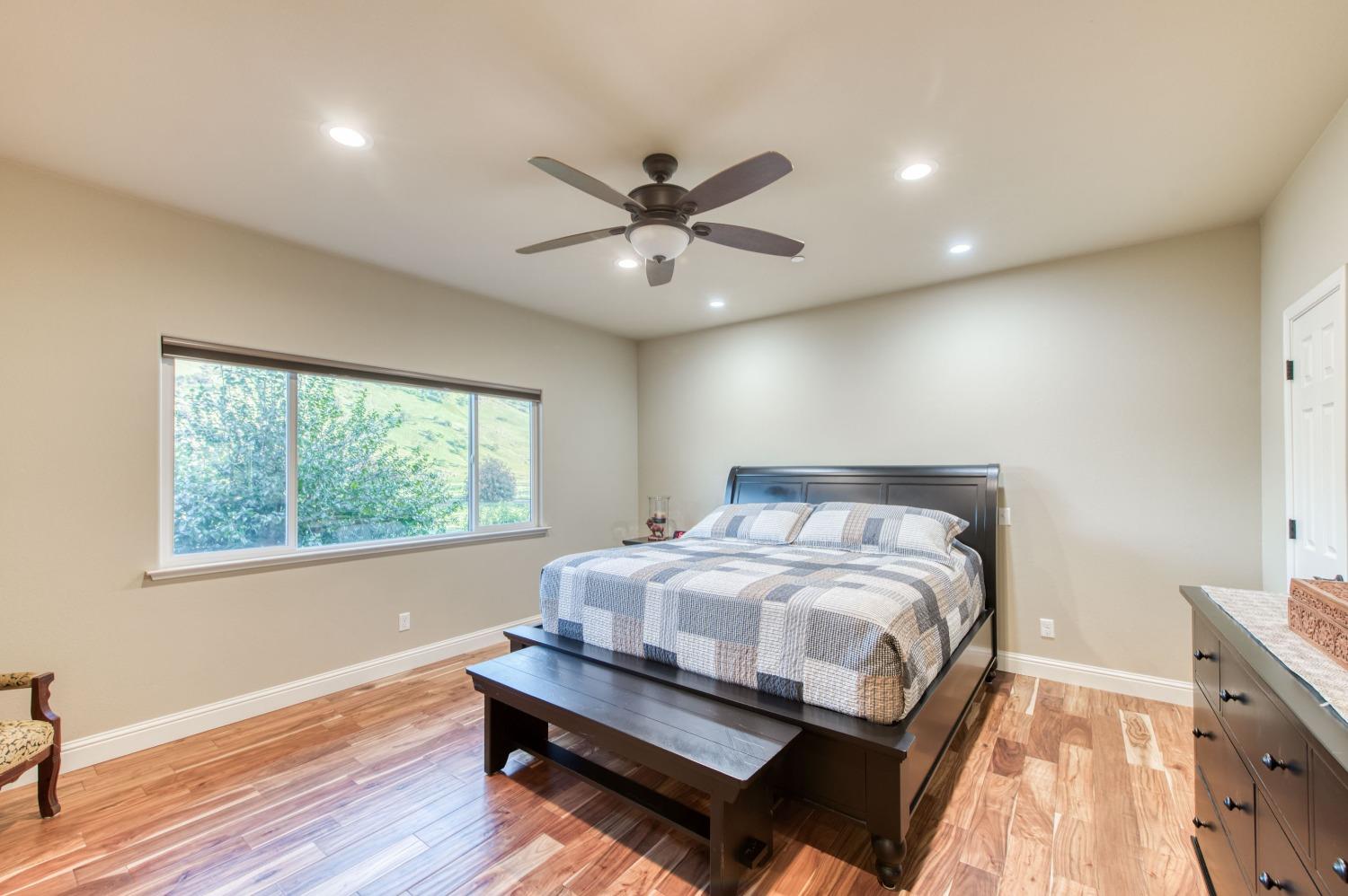 20431 Thermal Road Sanger, CA 93657 - Photo 22 of 88 a bedroom with a bed and a ceiling fan